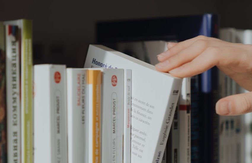 person picking a book